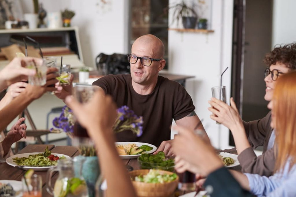 Man celebrating with his family representing long-term financial security and future planning.