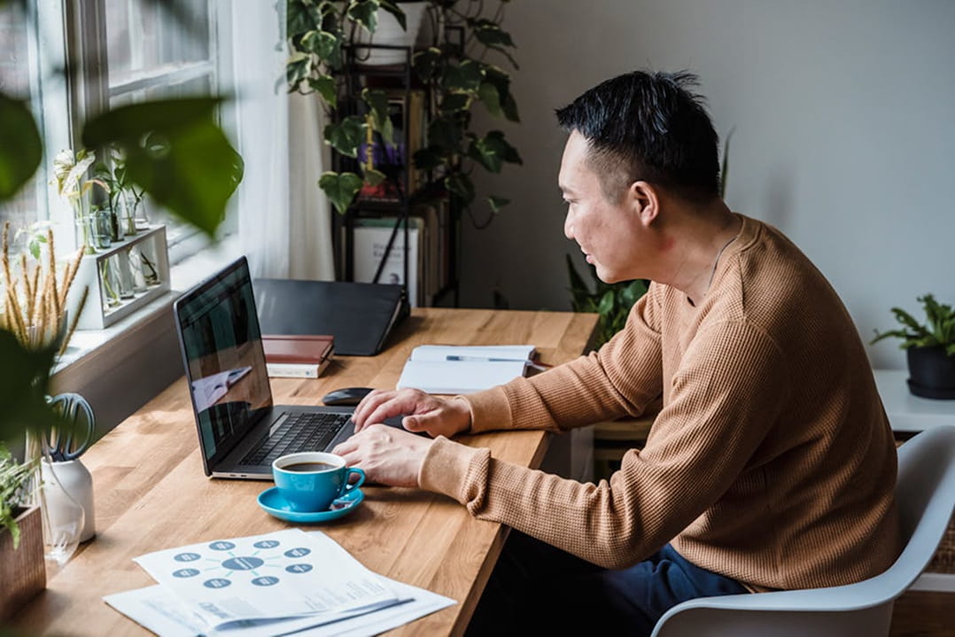 A man reviewing long-term wealth planning strategy at home