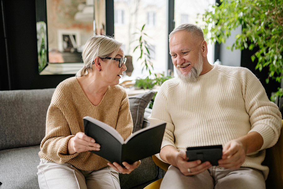 Retired couple discuss finances, symbolising retirement planning and financial readiness in Australia.