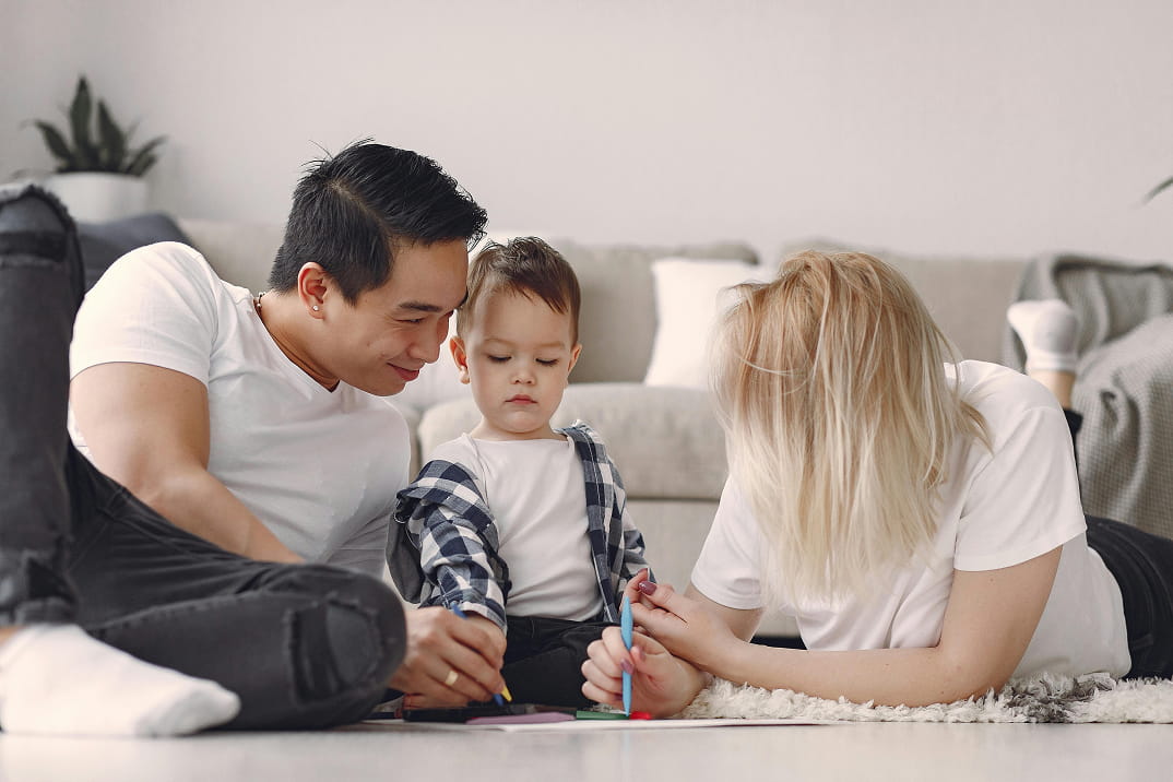 Young parents playing with their child