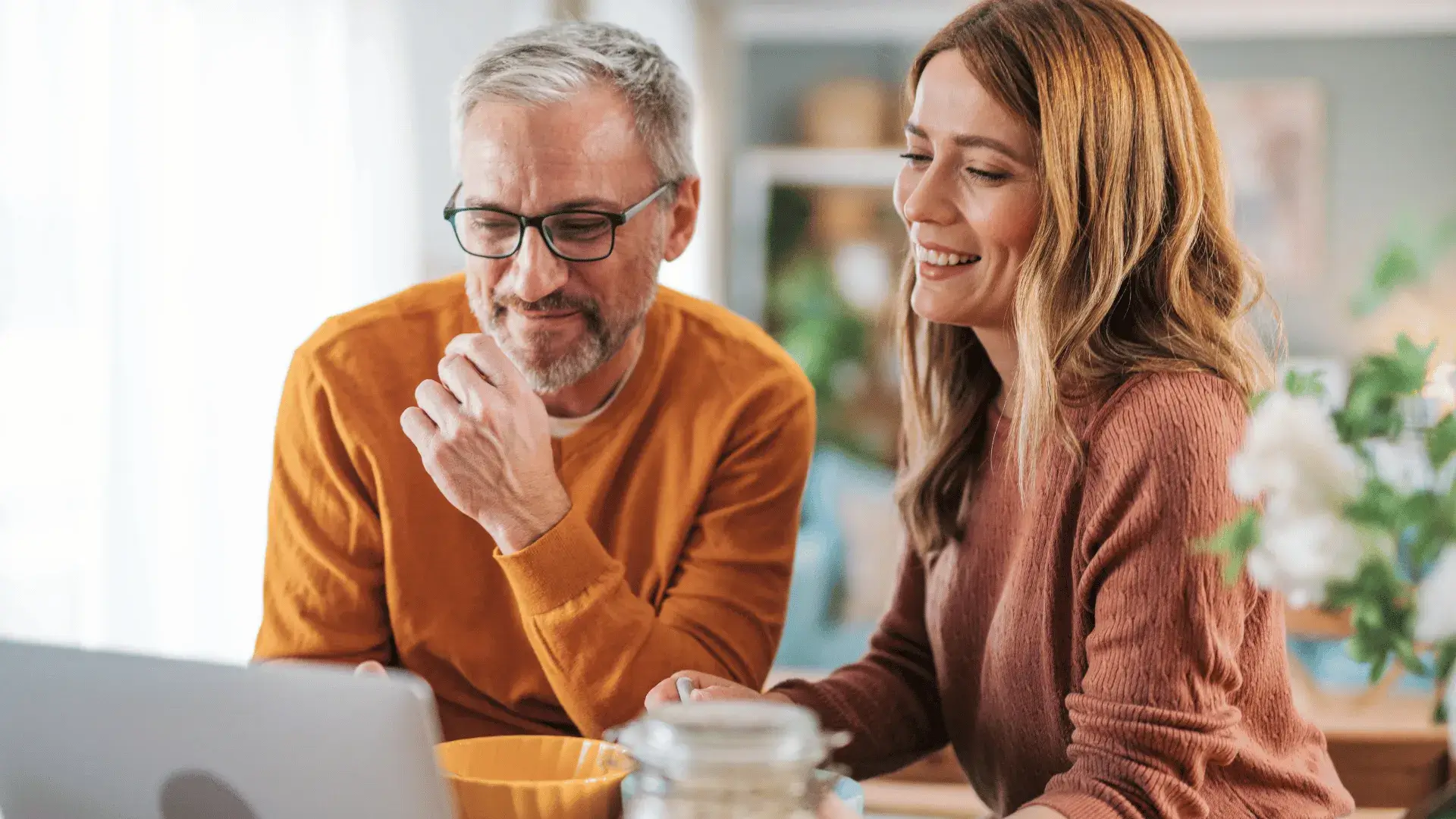 Couple discussing investments and long-term financial goals as part of a wealth management strategy.
