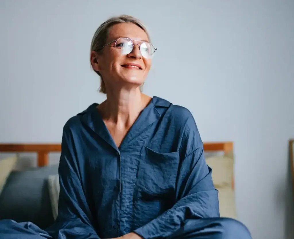 Woman reflecting on her future financial goals and retirement plans.